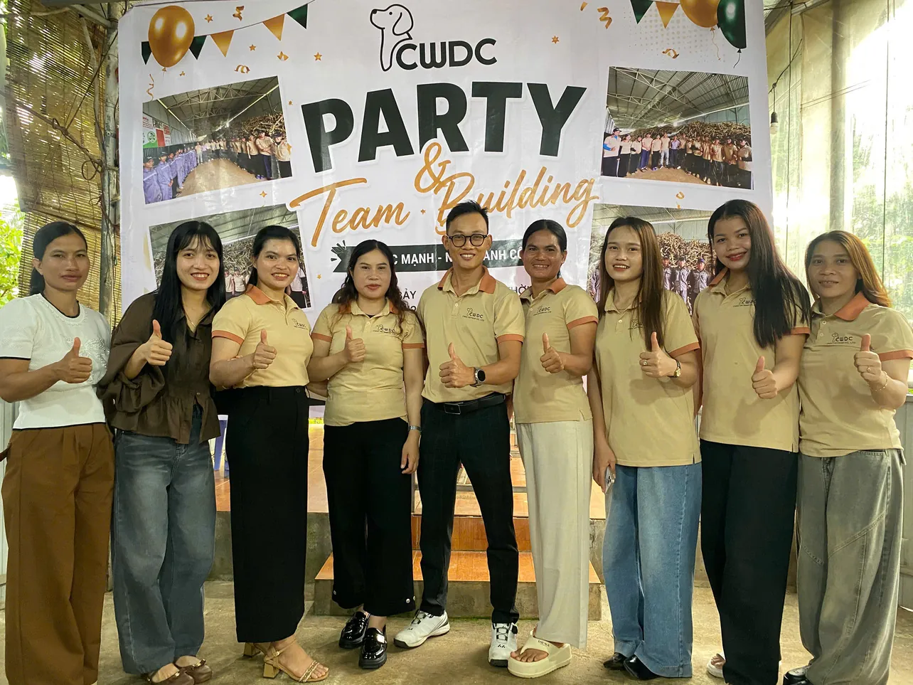 Colleagues from the production and quality teams celebrate together.
