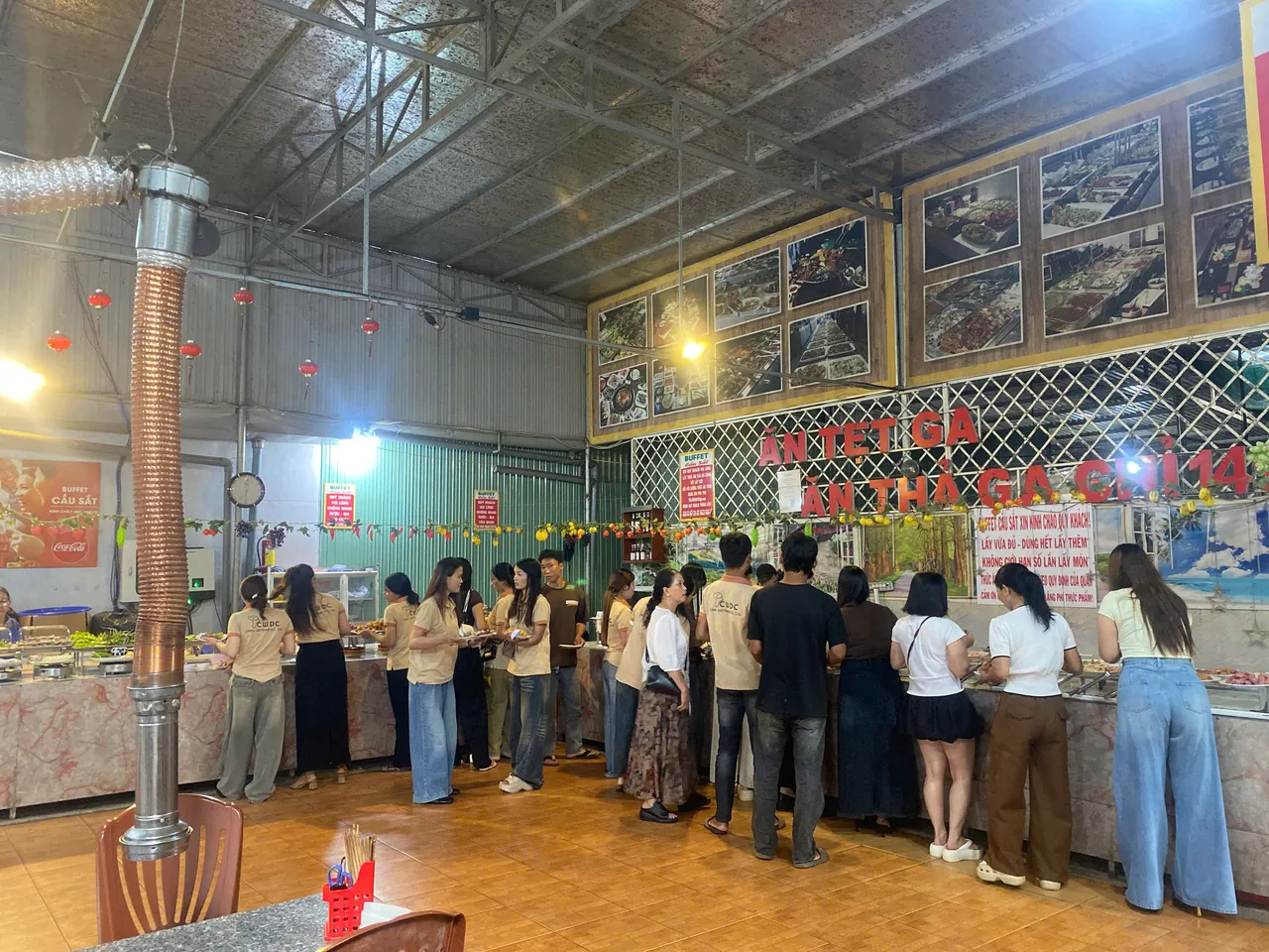 the-cwdc-vietnam-team-lines-up-at-the-buffet-counters-trading-production-talk-for-dinner-plates